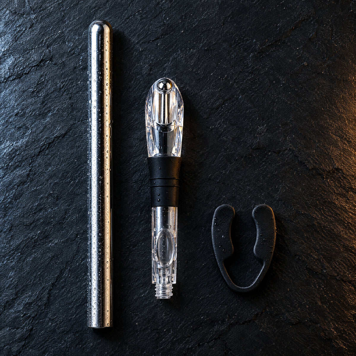 The four pieces laid out on dark slate