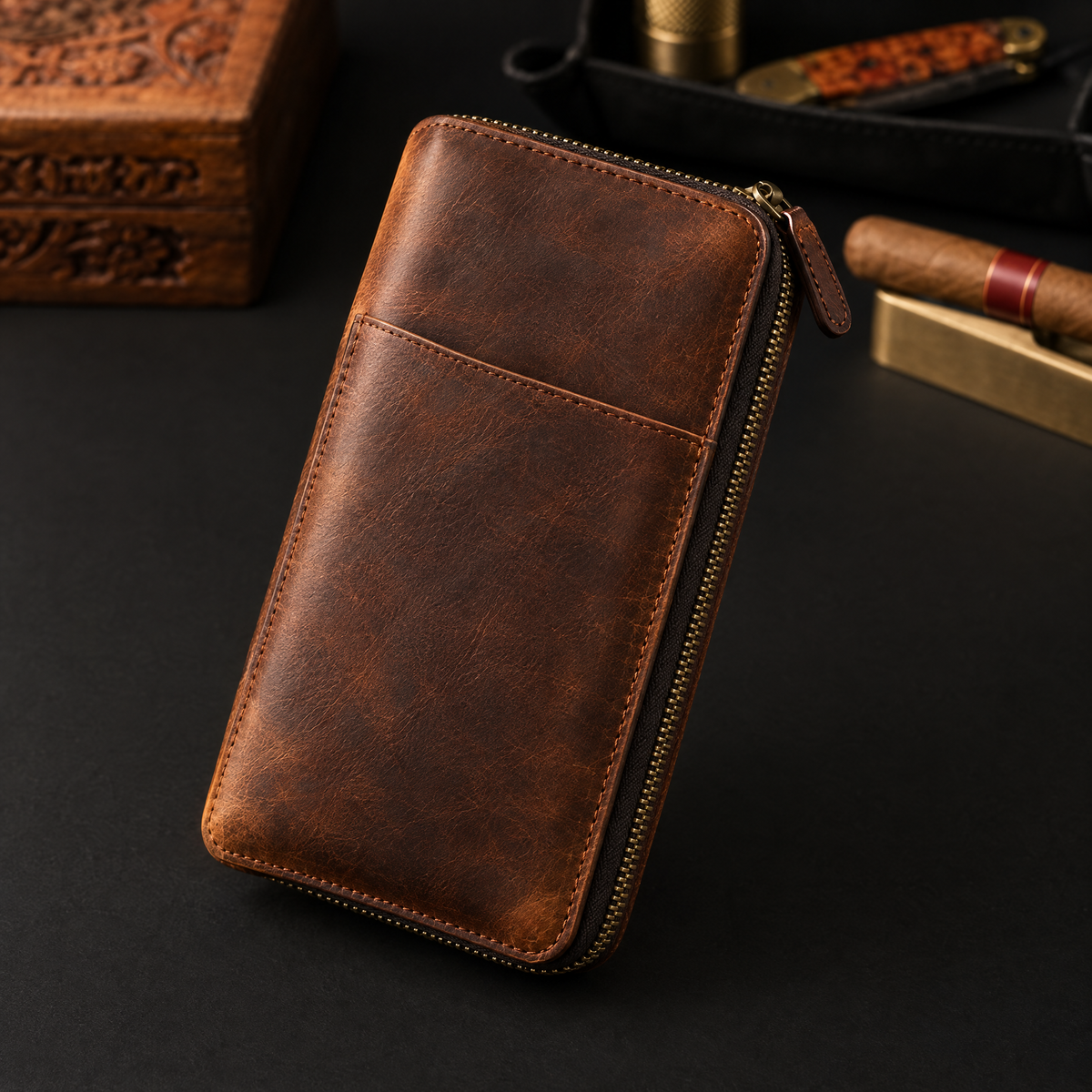 Brown crazy-horse leather cigar and travel organiser standing closed, antique brass zip round three edges